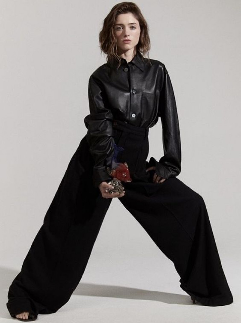 Natalia Dyer wears a stunning floral maxi dress, exuding timeless beauty and captivating elegance.: 