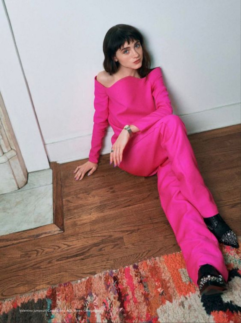 Natalia Dyer looks stunning in a red outfit, exuding timeless elegance at the star-studded gala.: 